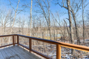 Fox Den Cabin deck with a view of nature, Fishtrap Village Rental Cabins